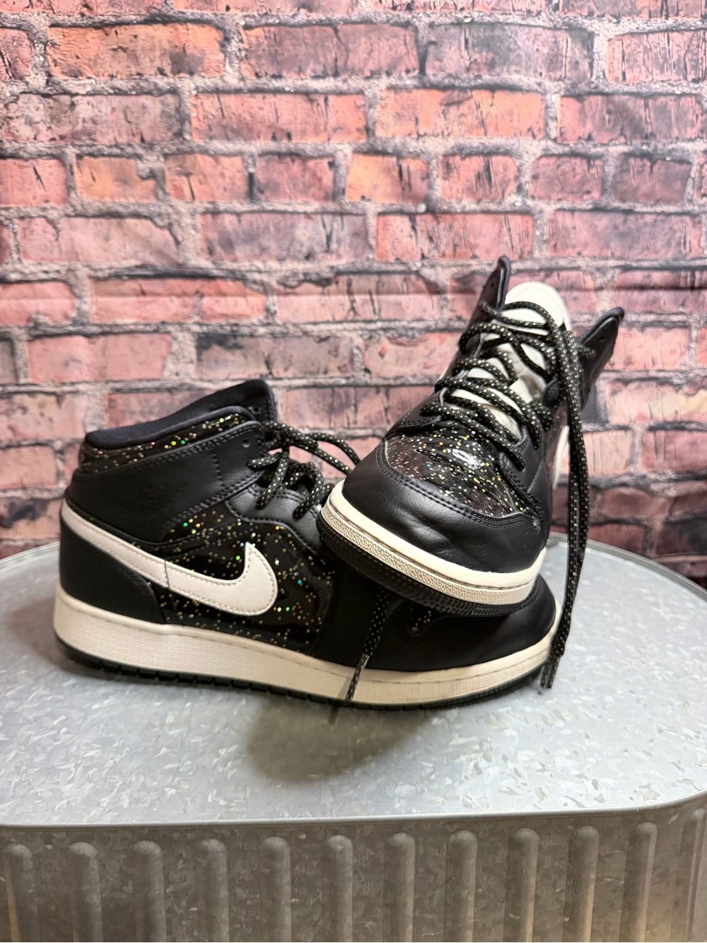 Nike Kids Black High-Top Sneakers with White Swoosh and Multicolor Speckle
